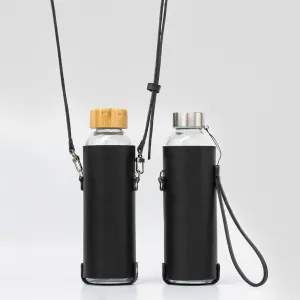 Leather water bottle holder with strap and glass bottle